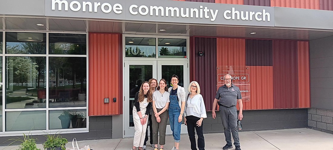 Pictured (L to R) are Hannah Tate, Sallie Hoy, Janae Wise, Tawn Kizer, Dr. Kim M. Reiff and Clif Palmer installing Grace students’ artwork at Monroe Community Church. Photo Provided