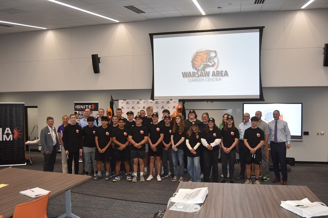 Warsaw Community Schools students in the Warsaw Area Career Center’s Regional Advanced Manufacturing Pathway program pose with WCS staff and business partners. Photo by Patrick Webb, InkFreeNews