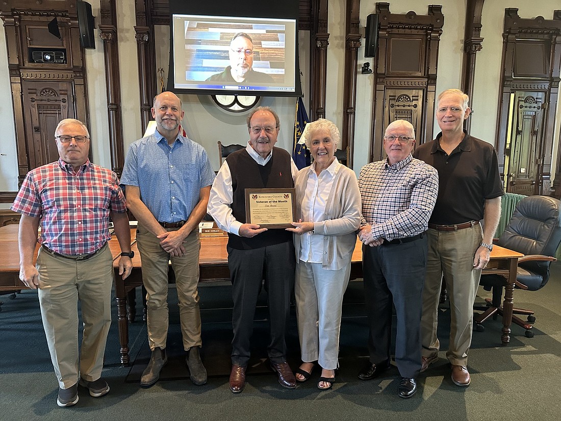 Tim Boone is the May 2024 Kosciusko County Veteran of the Month. Pictured (L to R) are Darryl McDowell, Kosciusko County veteran service officer; Cary Groninger, county commissioner; Tim and Linda Snyder Boone; Bob Conley and Brad Jackson, county commissioners. Photo by David Slone, Times-Union