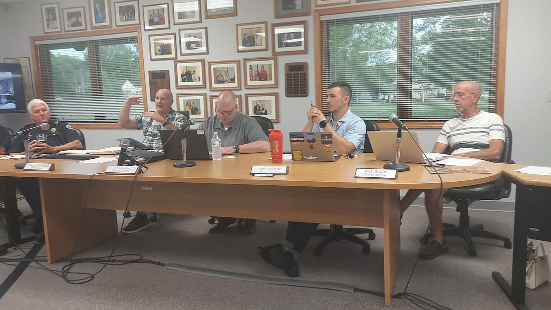 Pictured (L to R) are Winona Lake Town Marshal Joe Hawn, Town Manager Craig Allebach and Town Council members Jim Lancaster, Austin Reynolds and Rick Swaim. Photo by Jackie Gorski, Times-Union