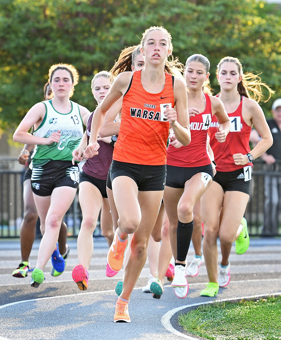 En route to winning the 1600 meter race, Warsaw senior Josefina Rastrelli leads all runners into the first turn...Nieter