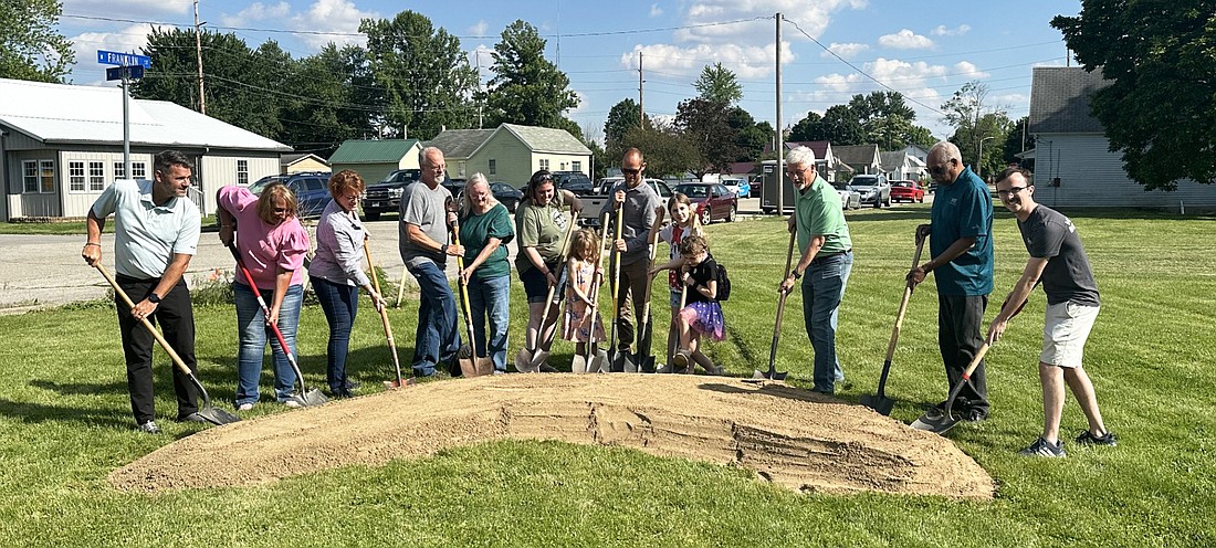 Habitat for Humanity of Kosciusko County had a groundbreaking ceremony Thursday for a home for the Boyd family at 405 N. Franklin St., Mentone. Pictured (L to R) are Josh Wildman and Audrey Russell, Wildman; Mindy Truex, Creighton Brothers; Tim and Jackie Croy; Kimber and Isabella Boyd; Drew Scholl, Wildman; Lexi and Aubrey Boyd; Jim Zaugg, Wildman; Bill Smith, Habitat for Humanity Board of Directors vice president; and Ben Logan, Habitat for Humanity executive director. Photo by David Slone, Times-Union.