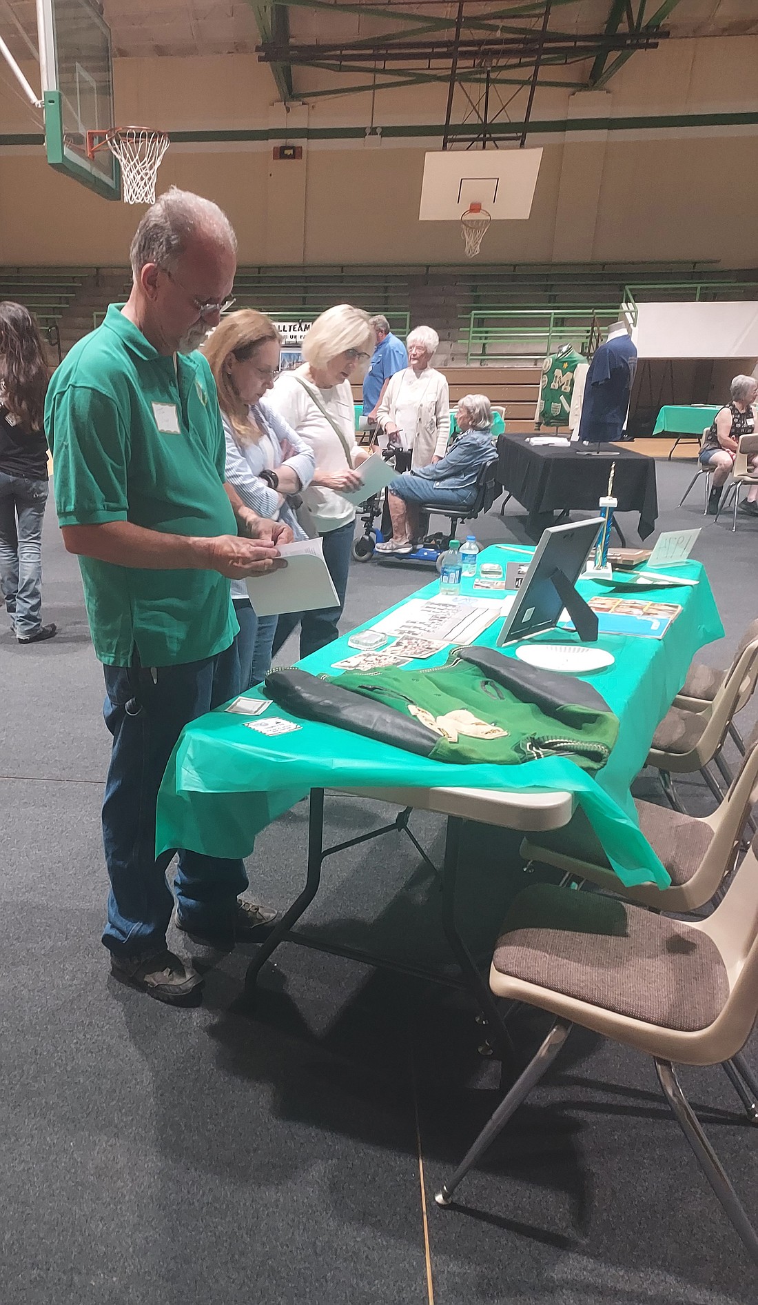 Tim Croy looks at one of the tables at the open house Saturday for the Mentone High School Class of 1974. Nine classes were able to put items like jackets and yearbooks on tables. Photo by Jackie Gorski, Times-Union