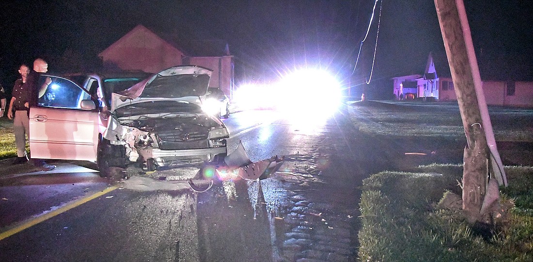 Officers tend to the victims involved in Saturday, June 1's late night single-vehicle accident on CR 175E, near CR 100N, after the vehicle hit a utility pole. Photo by Gary Nieter, Times-Union.