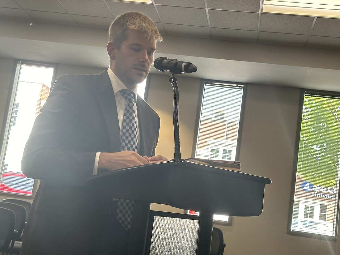 Andrew Mouser, director at Baker Tilly, explains the tax impact study on the tax increment financing district expansion to the Warsaw Redevelopment Commission on Monday. Photo by David Slone, Times-Union