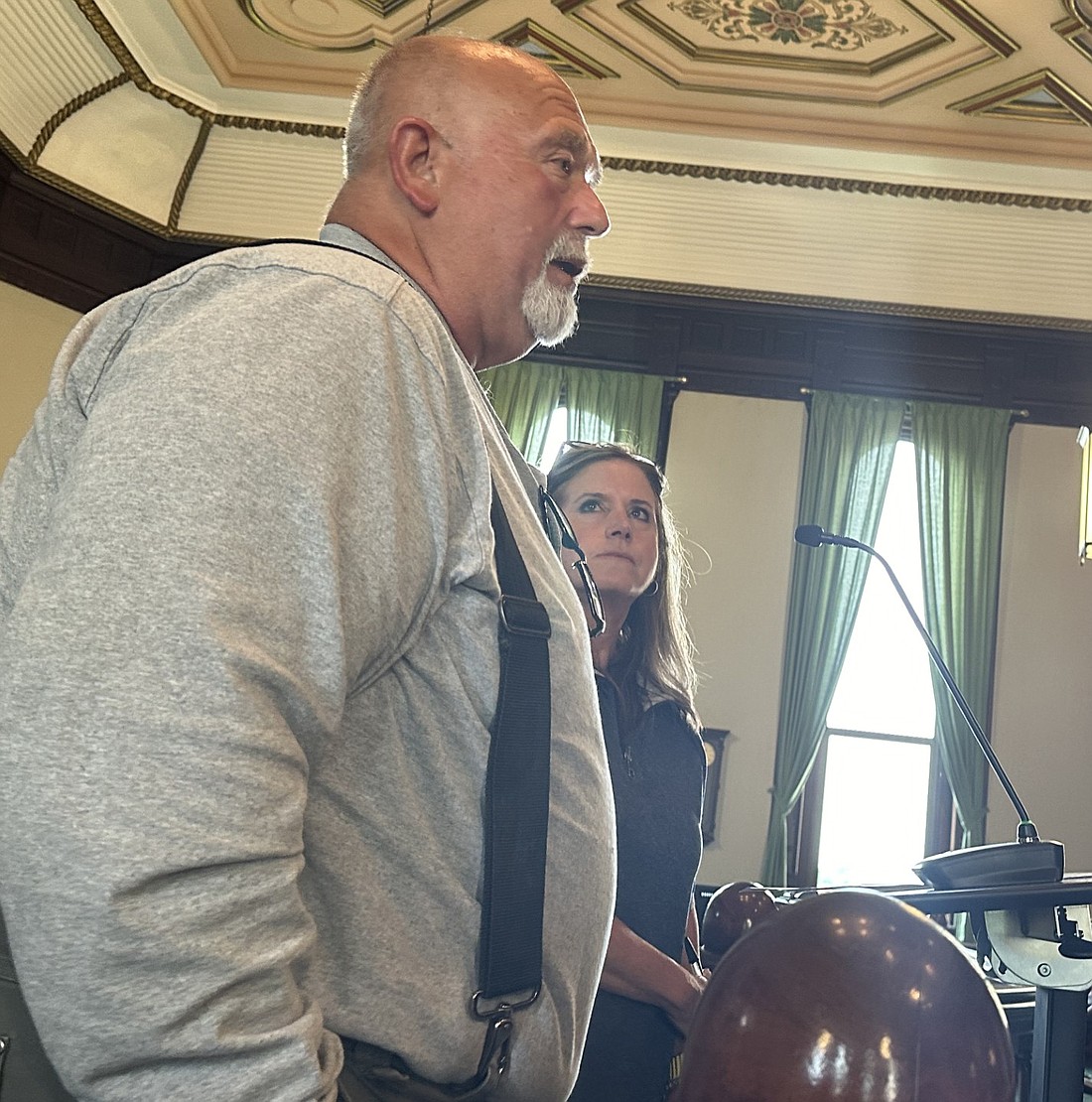 Kosciusko County Council President Mike Long (L) explains the purpose of a salary analysis by Reedy Financial Group to the Kosciusko County Commissioners on Tuesday while Vice President Kathy Groninger (R) listens. Photo by David Slone, Times-Union