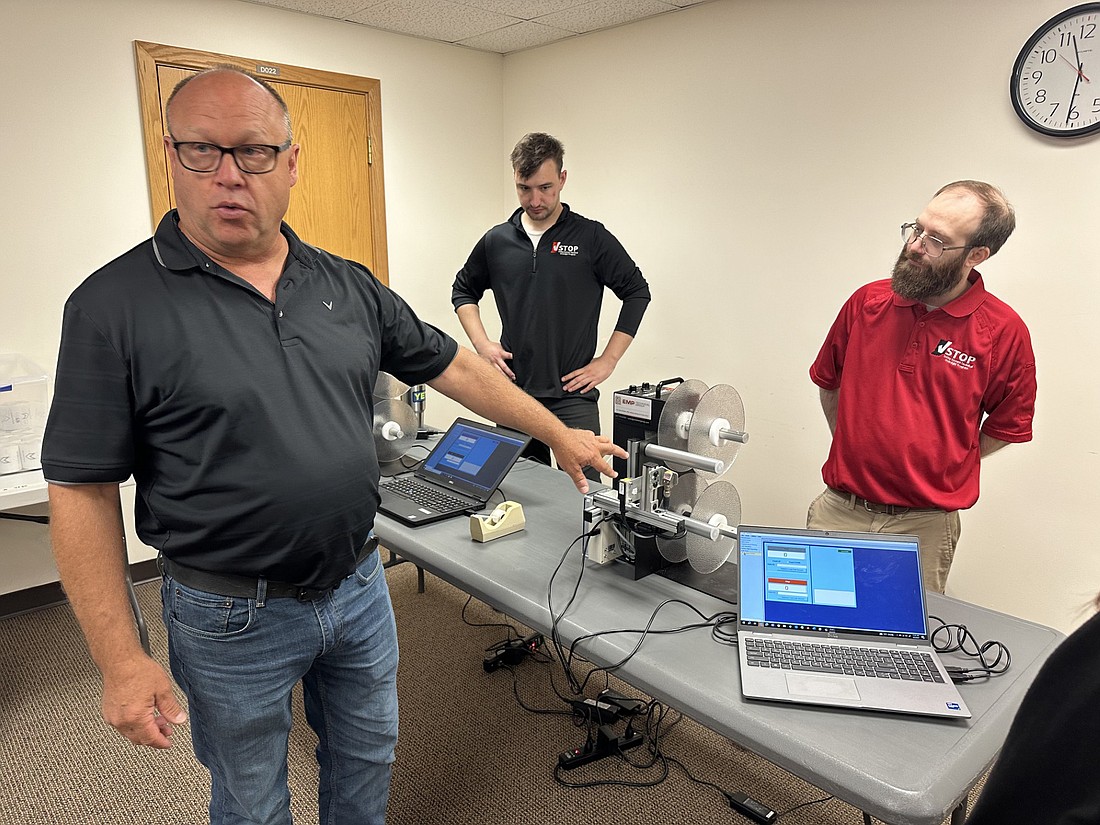 Steve Shamo, MicroVote, explains the rewinder machines during June 5’s post-election audit in multi-purpose room of the Justice Building. Photo by David Slone, Times-Union