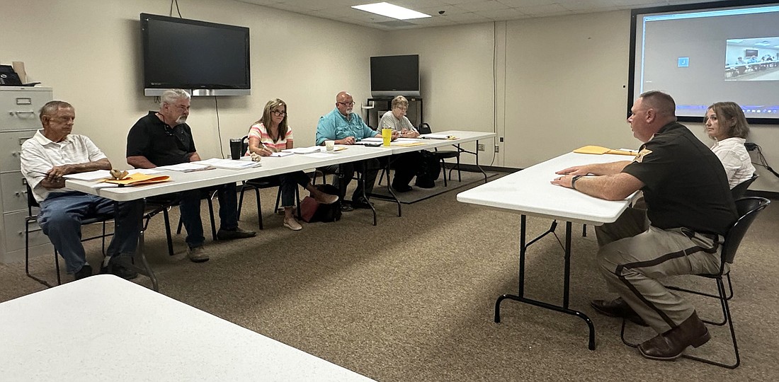 Kosciusko County Council members (L to R) Dave Wolkins, Tony Ciriello, Kathleen Groninger, Mike Long and Sue Ann Mitchell listen Thursday as Sheriff Jim Smith, sitting next to jail matron Michelle Hyden, explains the need to increase the jail medical care budget for 2025. Photo by David Slone, Times-Union