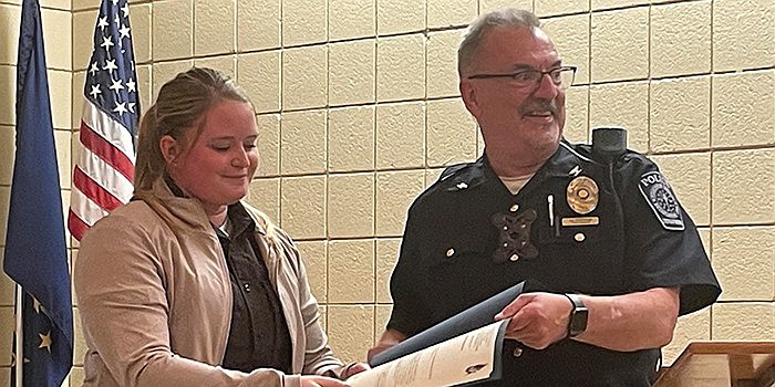 Pierceton Police Department officer Ashley Jones receives a letter of commendation from Town Marshal Jim Bumbaugh for her work alongside the FBI in investigating an interstate threat. Photo by Liz Adkins, InkFreeNews