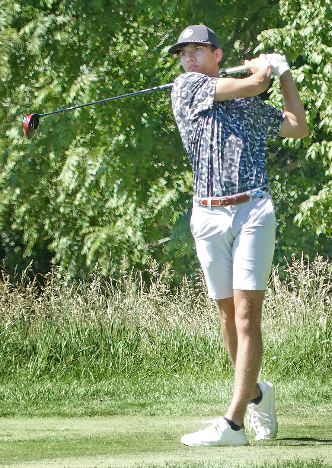 Junior Robbie Finlinson of Warsaw tees off on the third hole during Tuesday's round at the State Tournament in Carmel...Nieter