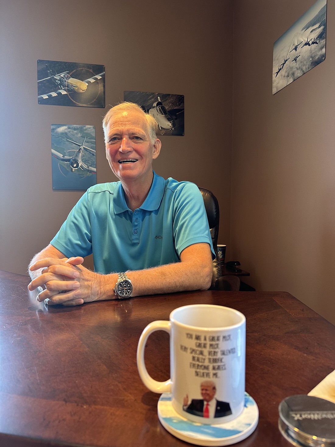Brad Jackson, northern district county commissioner, talks about his 28 years of service to the county Tuesday in his hangar office at the Warsaw Municipal Airport. Photo by David Slone, Times-Union