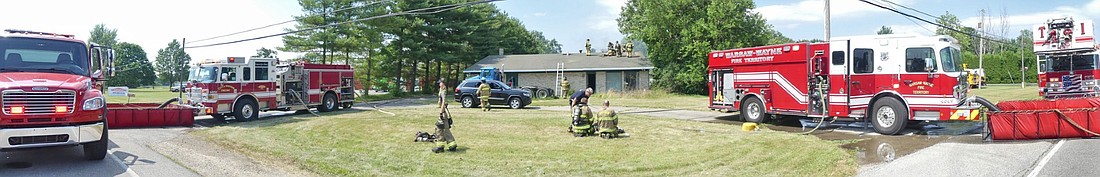 A panoramic view shows the scene of Sunday afternoon's fire on Old 30W, with multiple fire departments responding to a house fire. Photo by Gary Nieter, Times-Union