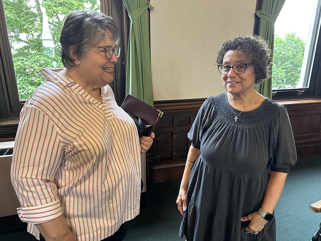 New Kosciusko Economic Development Corporation (KEDCO) CEO Peggy Friday (R) speaks with Suzie Light, KEDCO leadership partner, before the Kosciusko County Commissioners meeting on Tuesday. Photo by David Slone, Times-Union