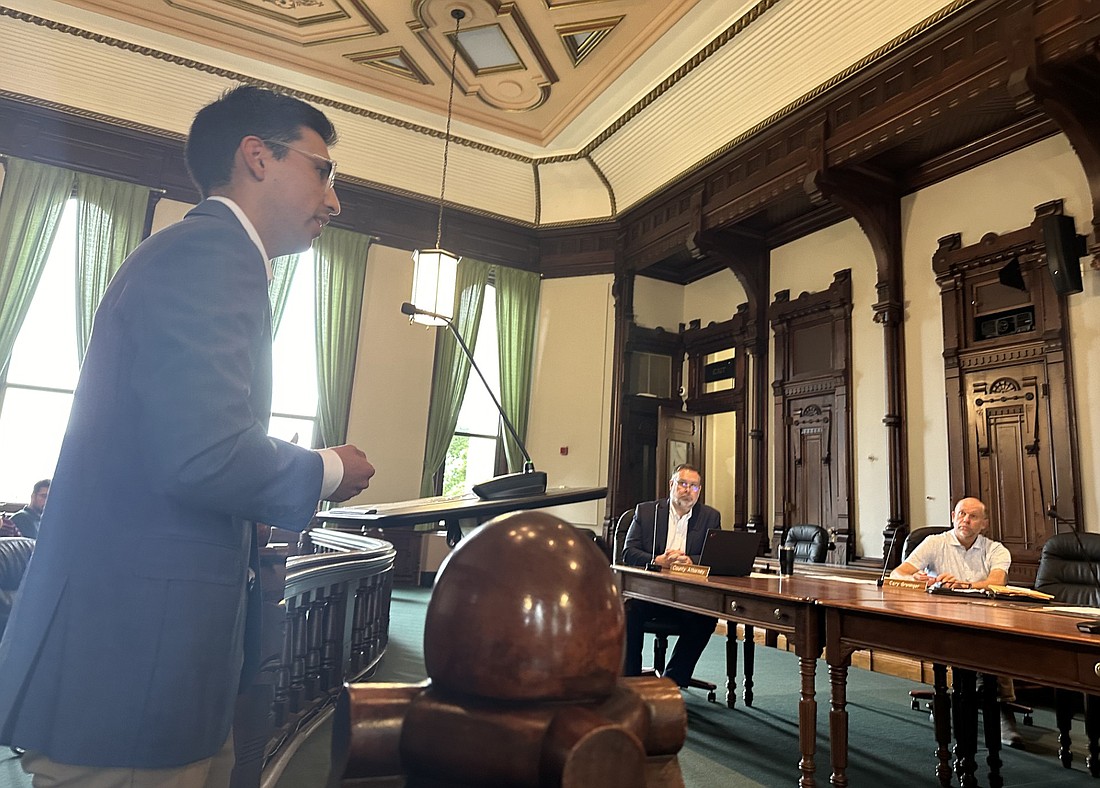 Lucas Fonseca, Language Matters co-founder and CEO, speaks to the Kosciusko County Commissioners Tuesday. Pictured seated are county attorney Ed Ormsby and Commissioner Cary Groninger. Not pictured, but present, are Commissioners Brad Jackson and Bob Conley. Photo by David Slone, Times-Union