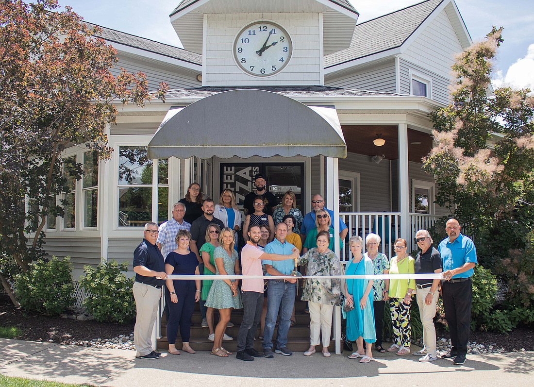 Kosciusko Chamber of Commerce held a ribbon-cutting for Light Rail Cafe Tuesday. Pictured are cafe staff and Chamber staff and ambassadors. Photo by Lauren Klusman, Kosciusko Chamber of Commerce