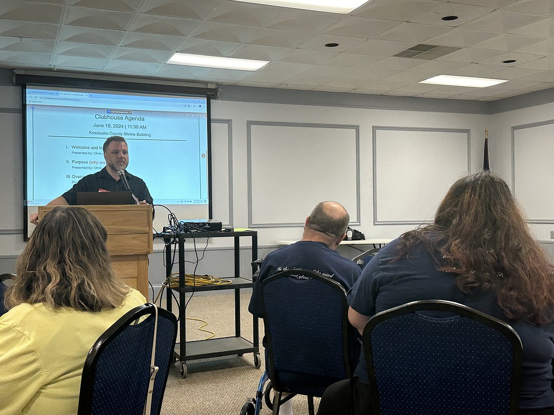 Mike Shorter, Clubhouse Indiana coordinator, speaks at Wednesday’s lunch and learn on Clubhouses and The Carriage House. The Carriage House members Matt Martino and Mary Rogers (seated at the right) also spoke. Photo by David Slone, Times-Union