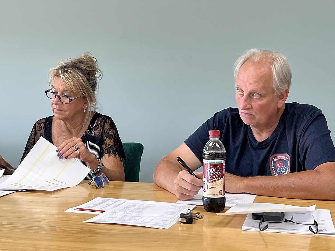 North Webster Town Council members Lisa Strombeck (L) and Dave Waliczek listen as Council President Dan Thystrup provides an update on the North Webster Trail project. Photo by Keith Knepp, InkFreeNews