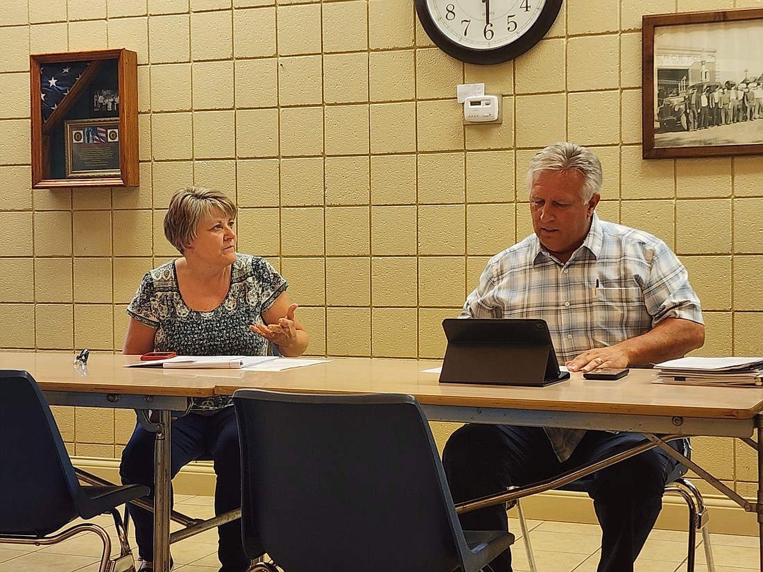 Pierceton Clerk-Treasurer Myra Mast and Council President Glenn Hall go over a few details prior to the special town council meeting. Photo by Deb Patterson, InkFreeNews