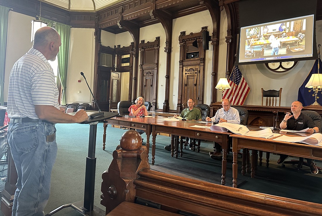 John Nelson (standing), project site manager with Triad Associates Inc., speaks to the Kosciusko County Department of Parks and Recreation Board about the Lake City Greenway (Chinworth trail) extension plans Thursday. Park Board members pictured (L to R) are Vice President Aggie Sweeney, Troy Turley, President Rob Bishop and Matt Metzger. Board member Mike Cusick was absent. Photo by David Slone, Times-Union