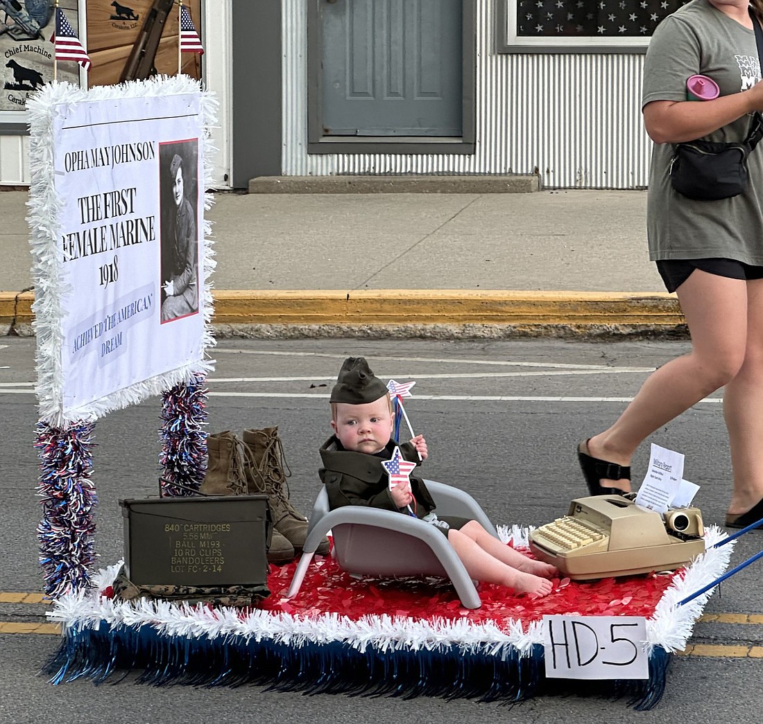 Celebrating the first female U.S. Marine was the hand-drawn float for Annie Hardy, daughter of Ethan and Ella Hardy, Warsaw. Photo by David Slone, Times-Union