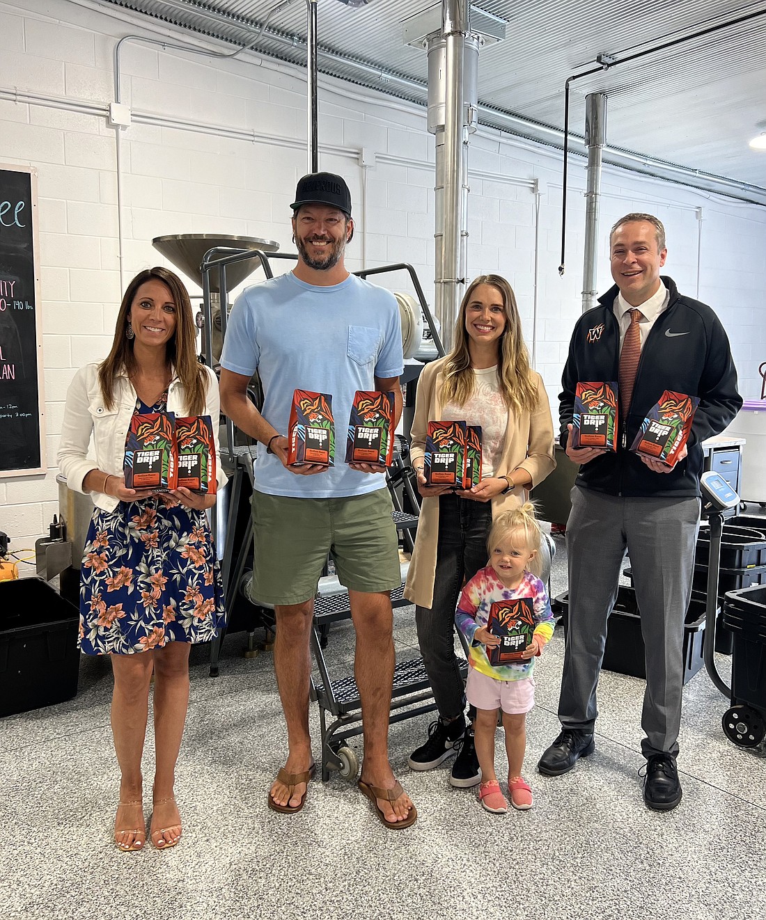 Pictured (L to R) are Krista Polston, Warsaw Community Schools director of communications; Tyler Silveus, Generous Coffee co-founder, Lia Geiger, graphic designer; and Dr. David Hoffert, WCS superintendent. Photo Provided.