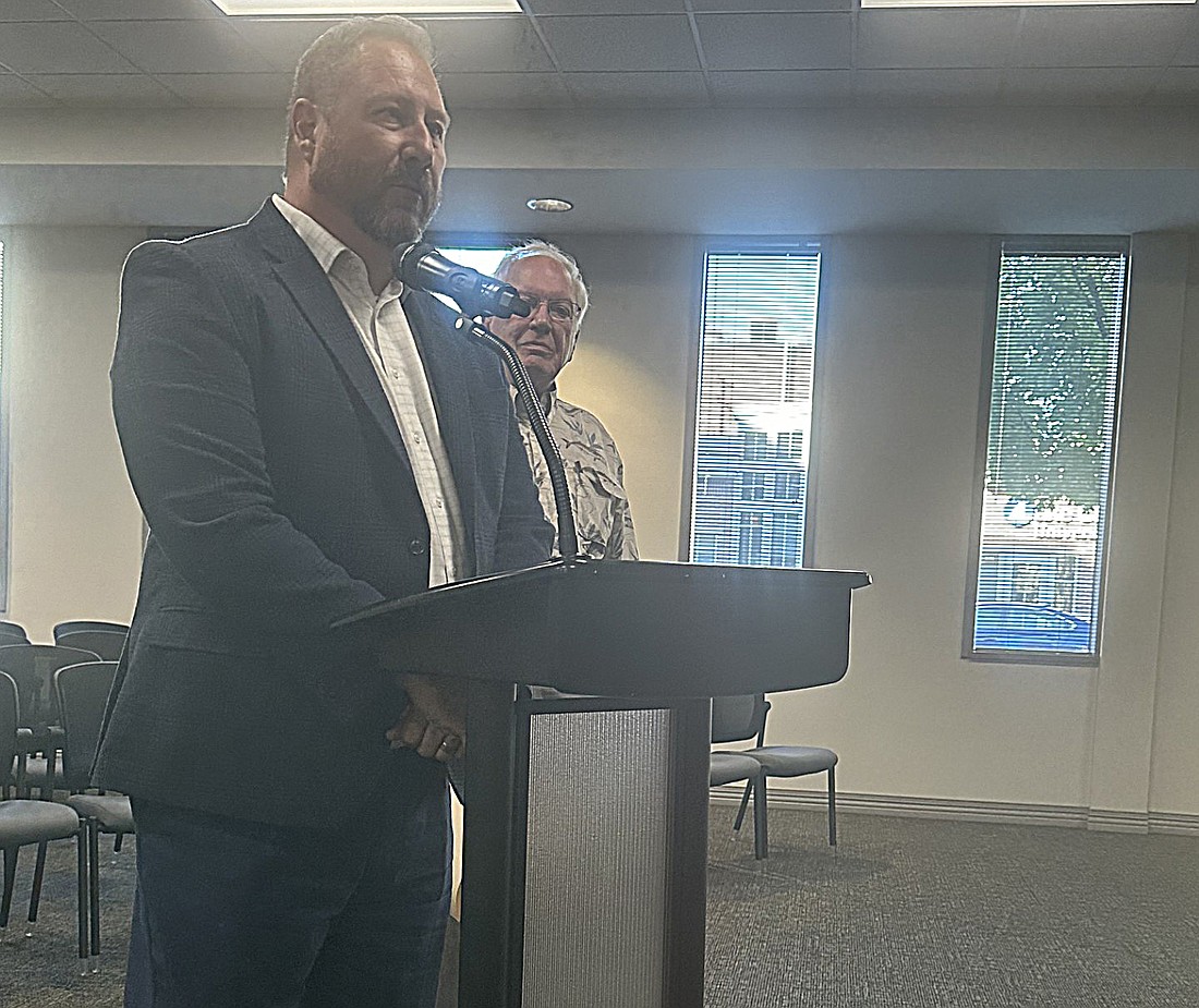 Jeff Goudy, Enterprise Rent-A-Car, Indianapolis, tells the Warsaw Board of Zoning Appeals about the leasing company’s temporary move to Crouse Body Shop on CR 250N, Warsaw. Pictured to his left is attorney Steve Snyder. Photo by David Slone, Times-Union