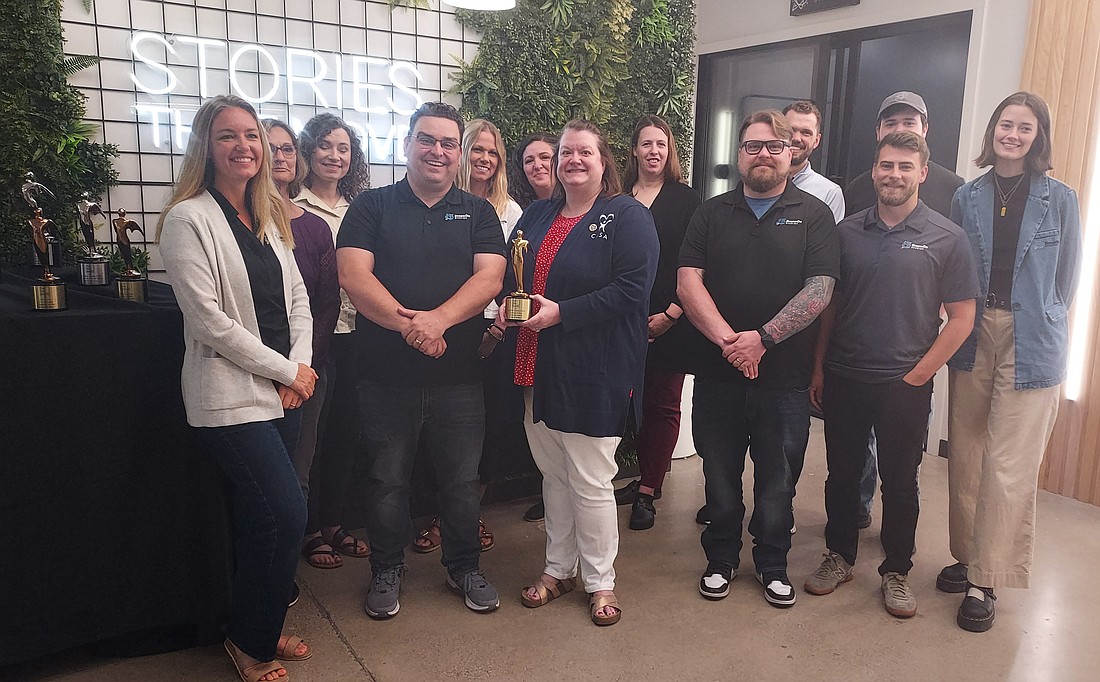 Pictured are staff of DreamOn Studios and members of Court Appointed Special Advocates of Kosciusko County. Photo by Jackie Gorski, Times-Union