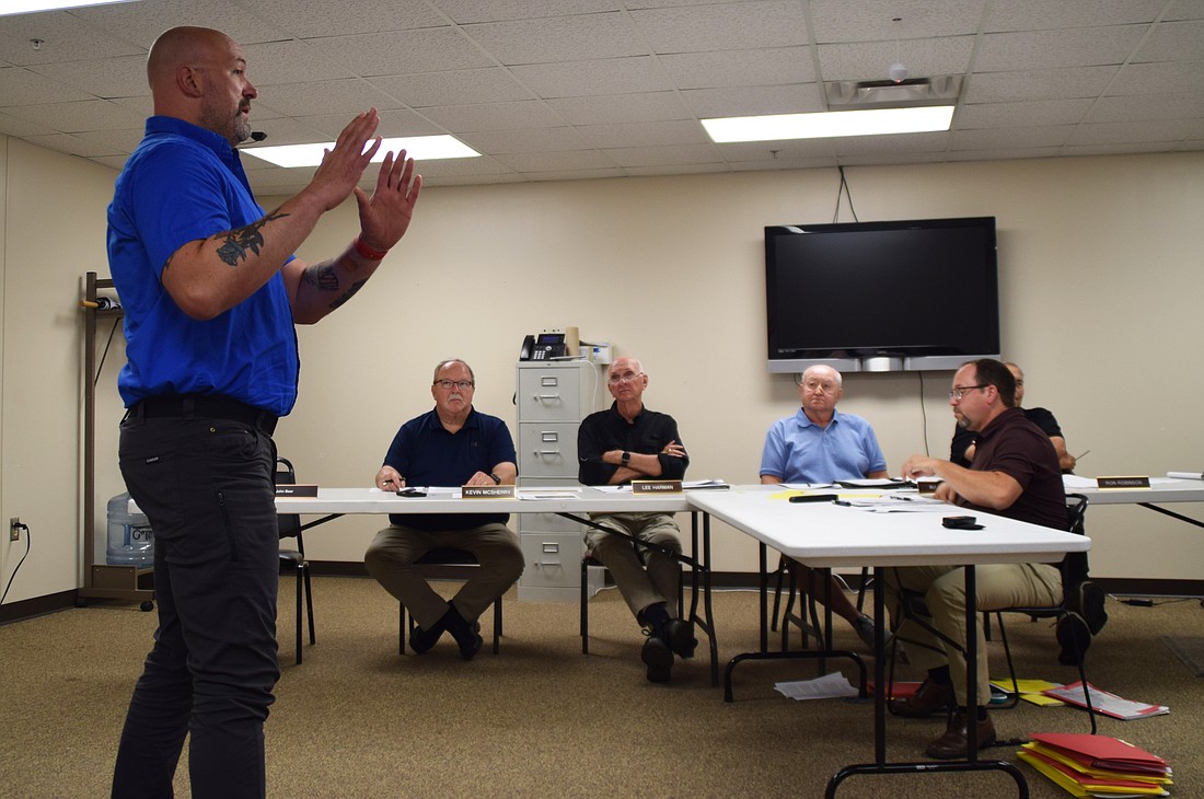 Chris Francis, Tippecanoe Township trustee, discusses the need for a new fire building with the Kosciusko County Board of Zoning Appeals. BZA members are Kevin McSherry, Lee Harman and Randy Cox. Also shown is Matt Sandy, area plan director. Photo by Lauren Zeugner, InkFreeNews.