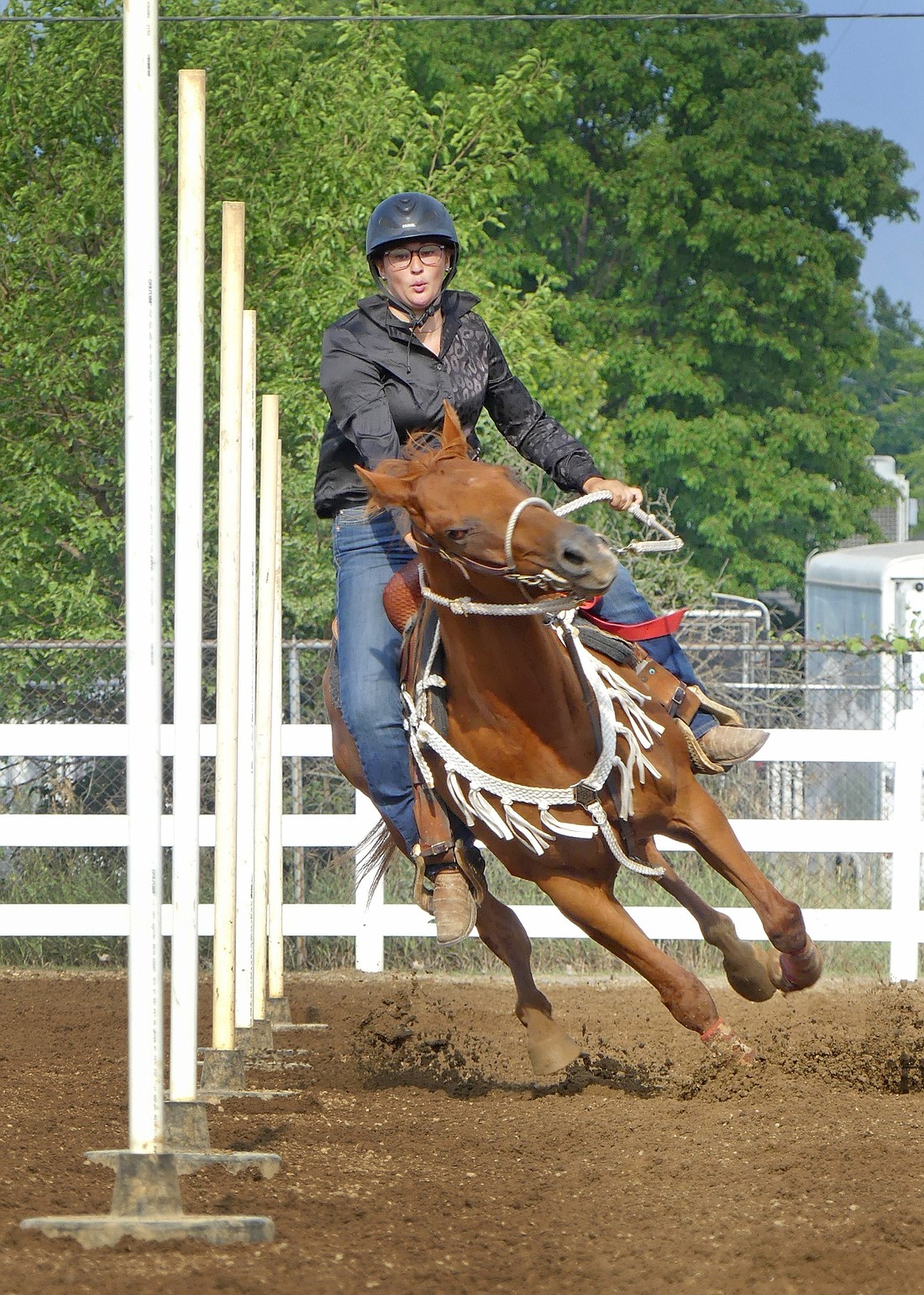 Reece Bays maneuvers her horse around the poles during Monday evening's Horse and Pony Show at the Fair. Photo by Gary Nieter, Times-Union