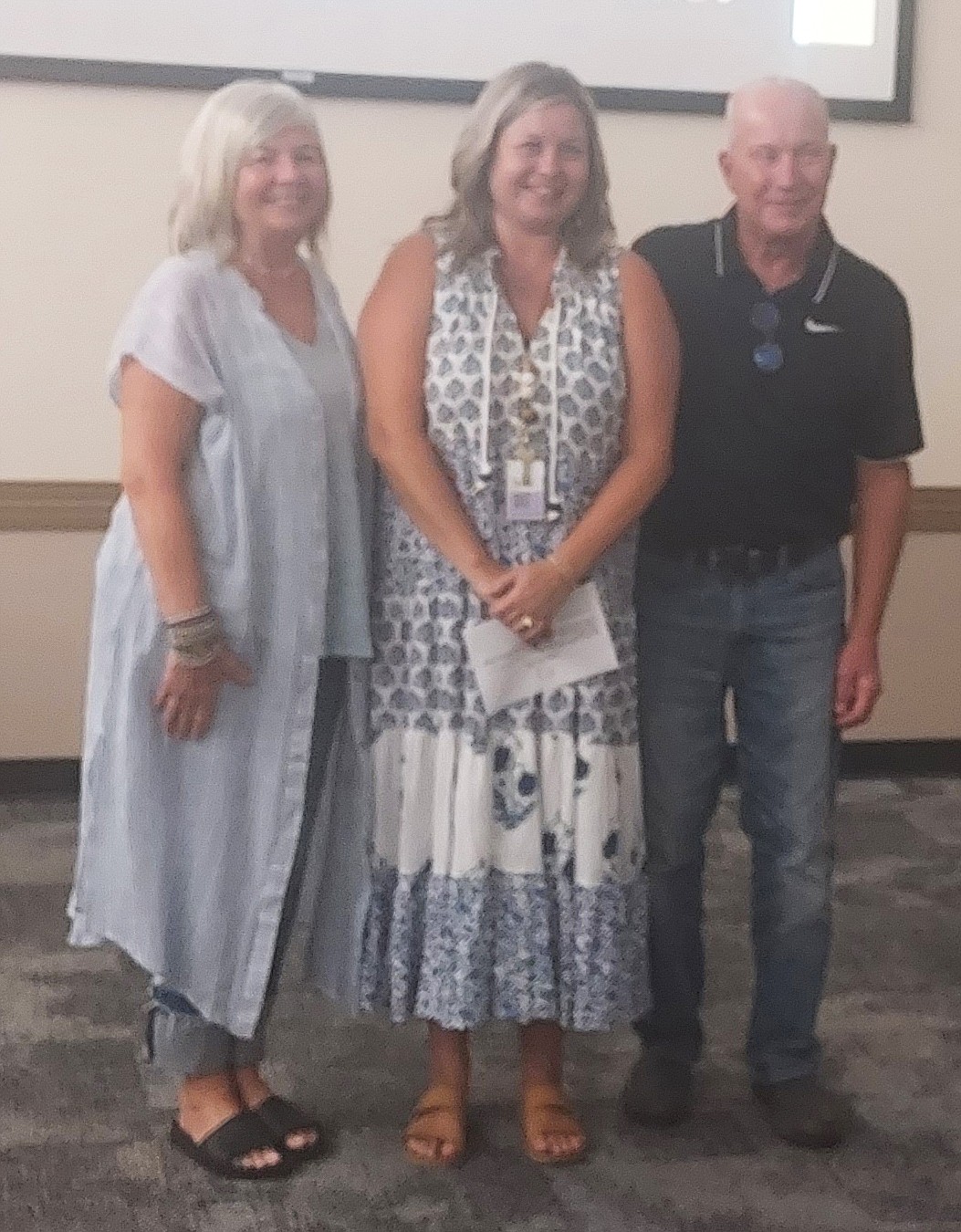 Pictured is Hilary Stouder (C), the new principal at Lincoln Elementary School, with her parents. Photo by Jackie Gorski, Times-Union