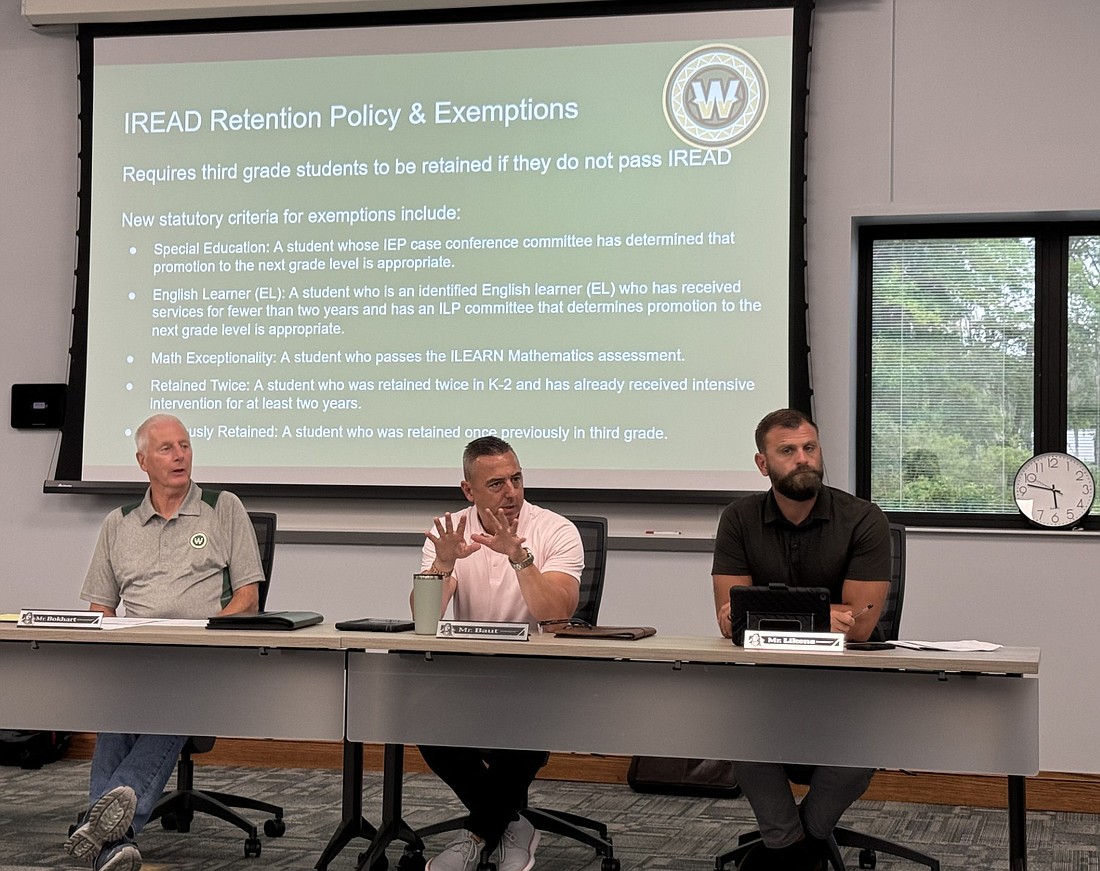 Wawasee School board member Steve Baut (C) asks for clarity regarding the math exceptionality exemption to Indiana’s recently passed IREAD retention policy. Pictured (L to R) are Don Bokhart, Baut and Neil Likens. Photo by Marisa Sweatland, InkFreeNews