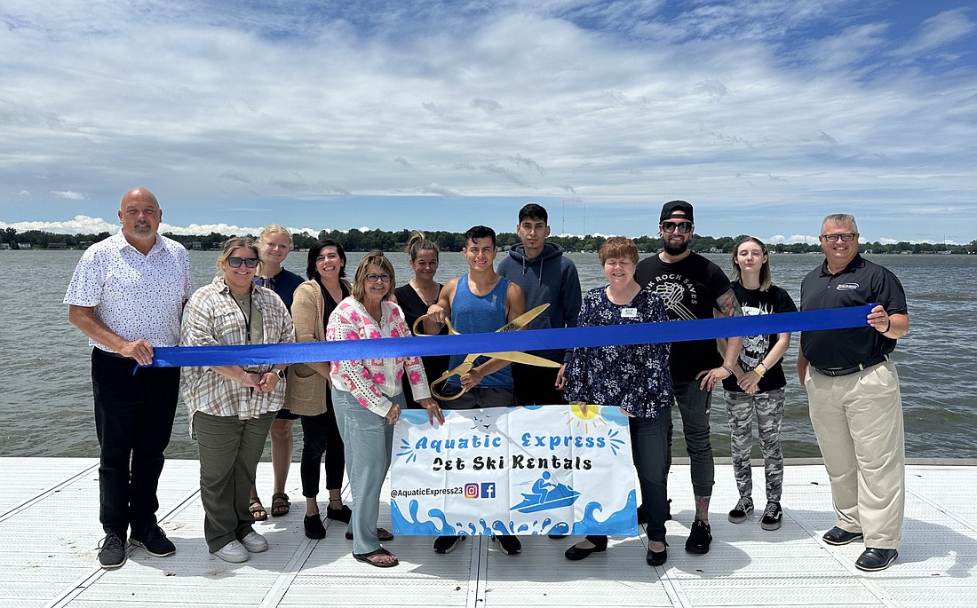 Aquatic Express, which offers jet ski rentals, had a ribbon-cutting ceremony Wednesday with the Kosciusko Chamber of Commerce. Pictured (L to R) are Scott Wiley, Chamber member relations manager; Kyrie Maierle, Cardinal Services, Chamber ambassador; Molly Kissling, Chamber; Kristi Hull, Hunsche CPA Group, Chamber ambassador; Dawn Jaggers, American Family Insurance, Chamber ambassador; Melissa Paxton, The Waters of Syracuse, Chamber ambassador; Luis Cervantes, Aquatic Express co-owner; Tito Cuellar, Aquatic Express co-owner; Lynn Brown, Lynn Brown Communications, Chamber ambassador; Nathan Underneath, Moving Pictures Tattoo Cinema, Chamber ambassador; Calissa Grindle, Moving Pictures Tattoo Cinema; and Rob Parker, Chamber president and CEO. Photo by David Slone, Times-Union