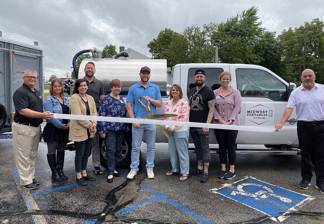 The Kosciusko Chamber of Commerce had a ribbon-cutting for Midwest Portables on Wednesday. It provides port-a-potties for events, personal use and more. Pictured (L to R) are Chamber President and CEO Rob Parker; Chamber ambassadors Melissa Paxton, Kristi Hull, Chris Scheeren and Lynn Brown; Midwest Portables owner Brandon Domark; Chamber ambassadors Dawn Jaggers, Nathan Underneath and Sarah Allison; and Chamber Member Relations Manager Scott Wiley. Photo by Leah Sander, InkFreeNews