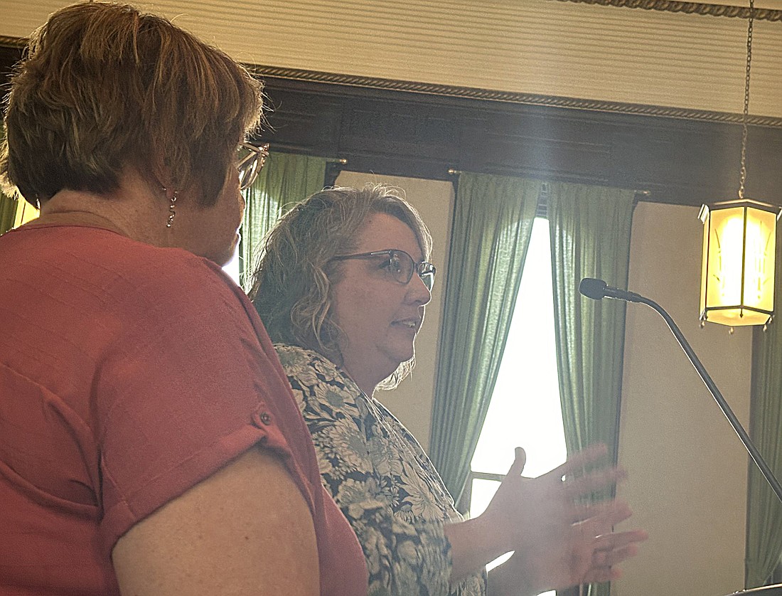 Kosciusko County Treasurer Michelle Puckett (R) and Assessor Gail Chapman (L) explain the mobile home and manufacturing home tax exemption ordinance to the Kosciusko County Council for the third time Thursday since April. Photo by David Slone, Times-Union