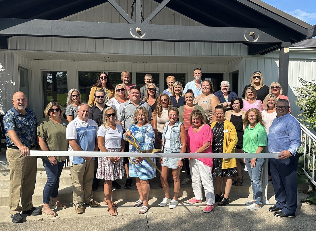 The North Webster-Tippecanoe Township Chamber of Commerce and the Kosciusko Chamber of Commerce had ribbon-cutting ceremonies Thursday morning for the Kosciusko Board of Realtors’ office at 920 S. Main St., North Webster. Pictured are members of the KBOR, the chambers’ ambassadors and staffs. Photo by David Slone, Times-Union