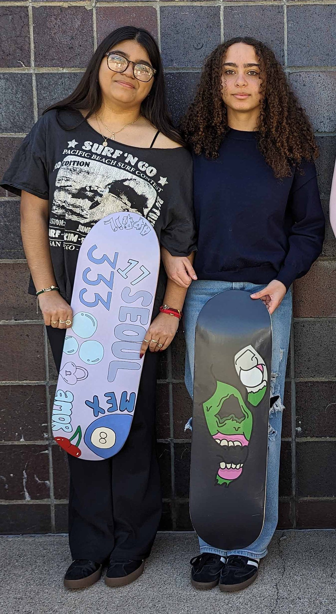 Pictured (L to R) are April Rodriguez and Makayla Bradford preparing for the upcoming exhibition. Photo Provided