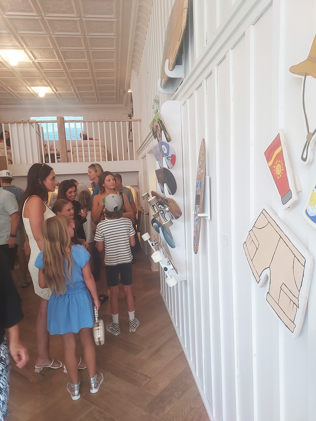 People view some of the displays at  the "Next Wave: Surf the Saw” exhibit at  Atelier, 104 E. Center St., Warsaw, Friday. Photo by Jackie Gorski, Times-Union