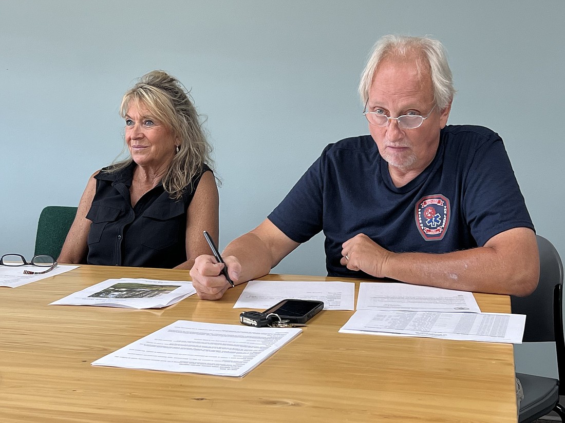 North Webster Town Council members Lish Strombeck (L) and Dave Waliczek listen as Gwen Fuchs offers an update on the planned "Jay Day" memorial celebration, which will take place Aug. 28. Photo by Keith Knepp, InkFreeNews