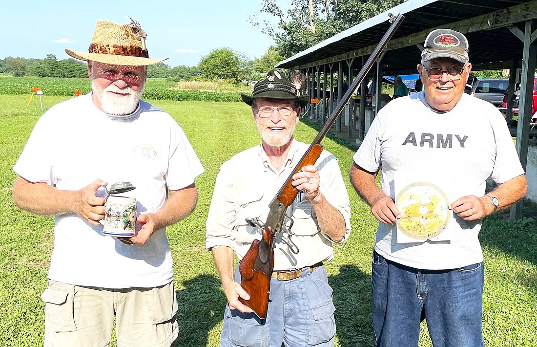 Entrants were allowed to continue to purchase shots to try to improve their standing until no one was left that wanted to purchase another shot. At that point, first, second, and third places were determined by their distances from the bull’s center and prizes were awarded. The photo of the three shooters (left to right) includes Roger Henderson, from Spencerville, OH, whose best shot placed third, Geoff Crowe, from Hopkins, MI, whose best shot was closest to the center for first place, and Fred Anderson, from Mentone, IN, who placed second with his best shot. The animal target shows the shots from all the entrants that hit the paper. (Thirteen hearty souls participated.) The photo of the rifle and closeups of engraving from 3 different German rifles are included to show how pretty the Schuetzen rifles can be.