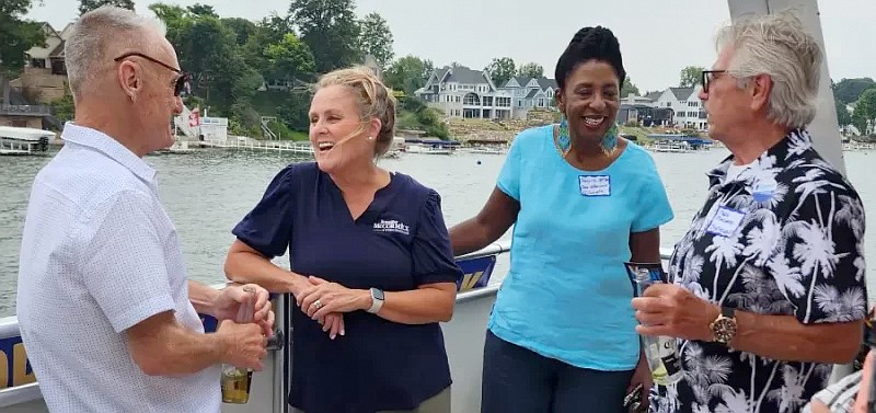 Robert Osbun (L) is shown talking with Jennifer McCormick, Democrat candidate for governor, while Dr. Valerie McCray talks with Mark Malane. Photo by Deb Patterson, InkFreeNews