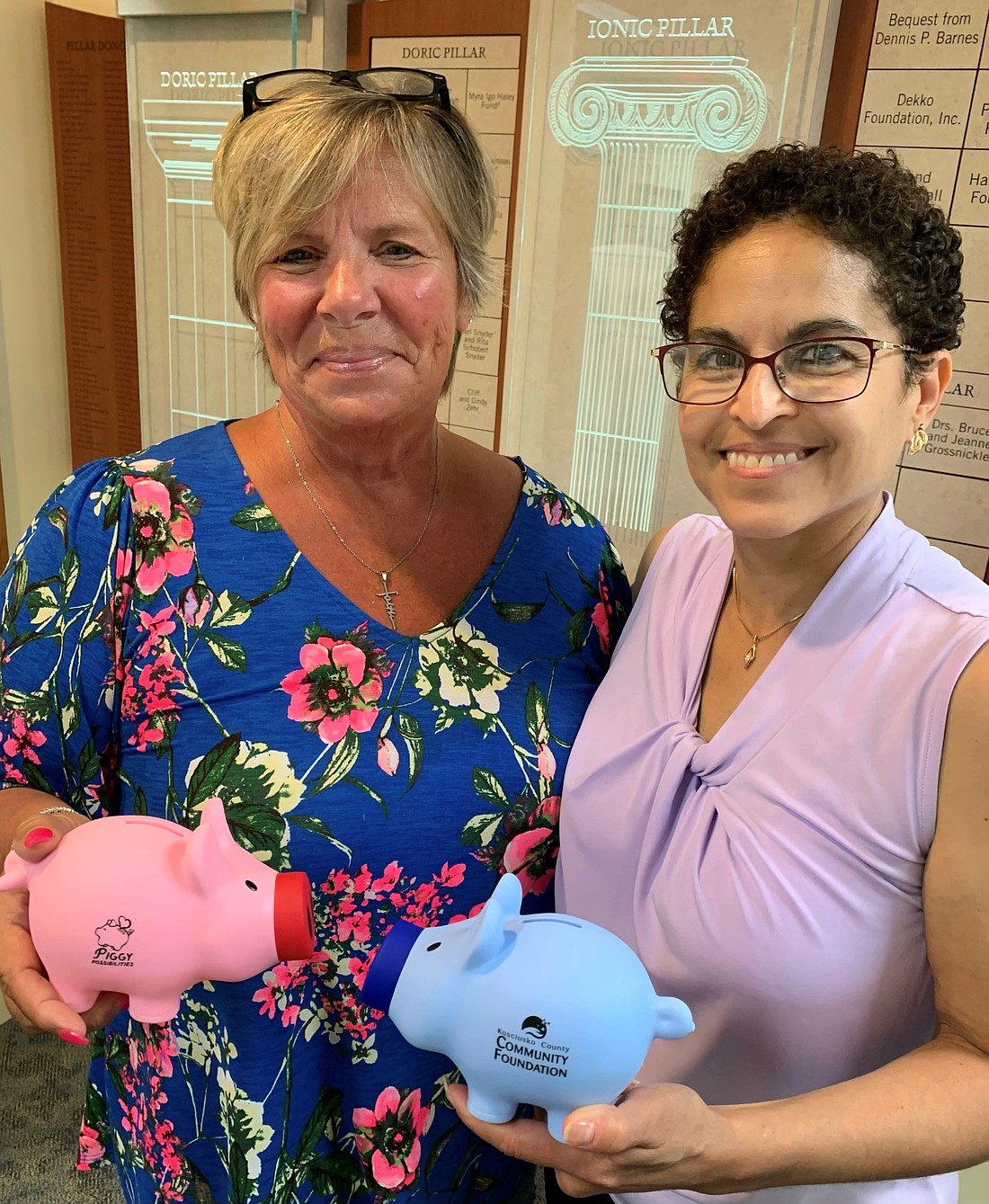 Pictured (L to R) are Deeana Marshall, fund founder, with Marlene Betances after Betances donated to the Piggy Possibilities Fund. Photo Provided.