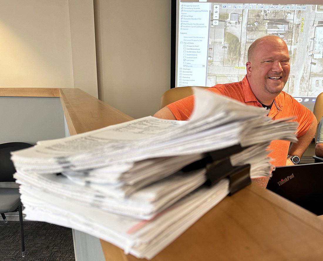 Warsaw Police Department Capt. Joel Beam displays the stack of speeding tickets for the month of July alone from blitzes the department conducted. Of the nearly 500 tickets, a majority of them were for speeders on U.S. 30 in the city. Photo by David Slone, Times-Union