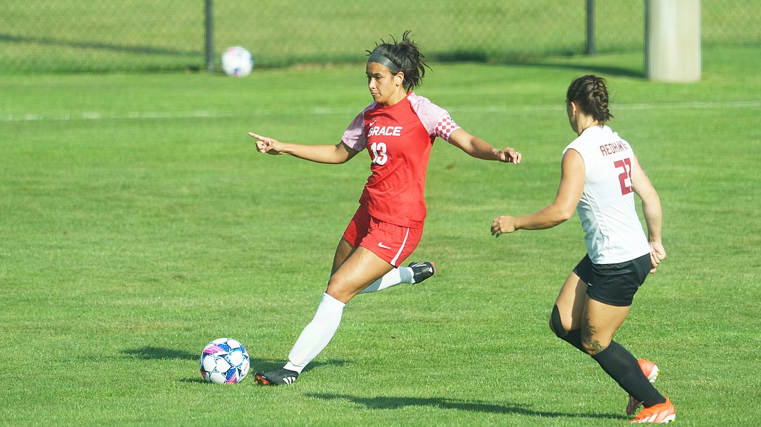 Pictured is Tori Twombly passing the ball for Grace's women's soccer team during an exhibition match on Saturday.