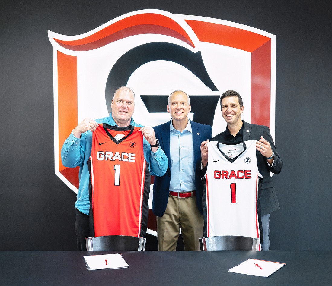 Pictured (L-R): Jim Lancaster, Chad Briscoe, Drew Flamm representing Zimmer Biomet and Grace for the announcement of the uniform sponsorship deal for the Lancers