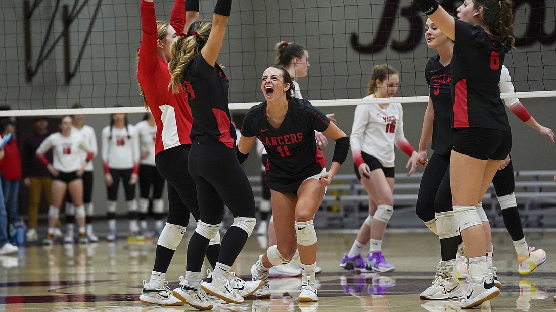 Pictured is Grace's volleyball team celebrating a point during its NCCAA national championship victory in December