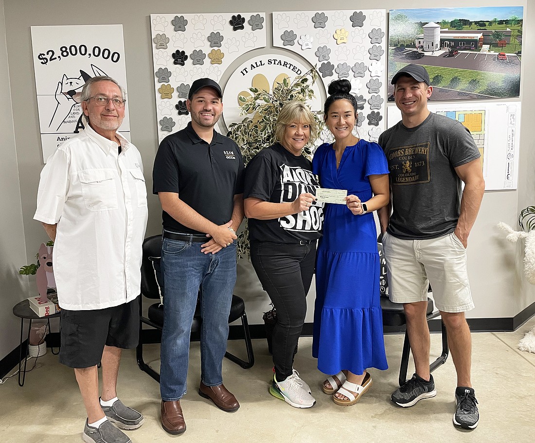 Pictured (L to R) are John Lantz, Animal Welfare League Board president; Scott Clay, Young Republicans secretary; Tonya Blanchard, AWL executive director; Mikie Crate, Young Republicans vice chair; and Joe Sobek, Young Republicans chairman. Not pictured is Shaun Brown, Young Republicans treasurer. Photo Provided