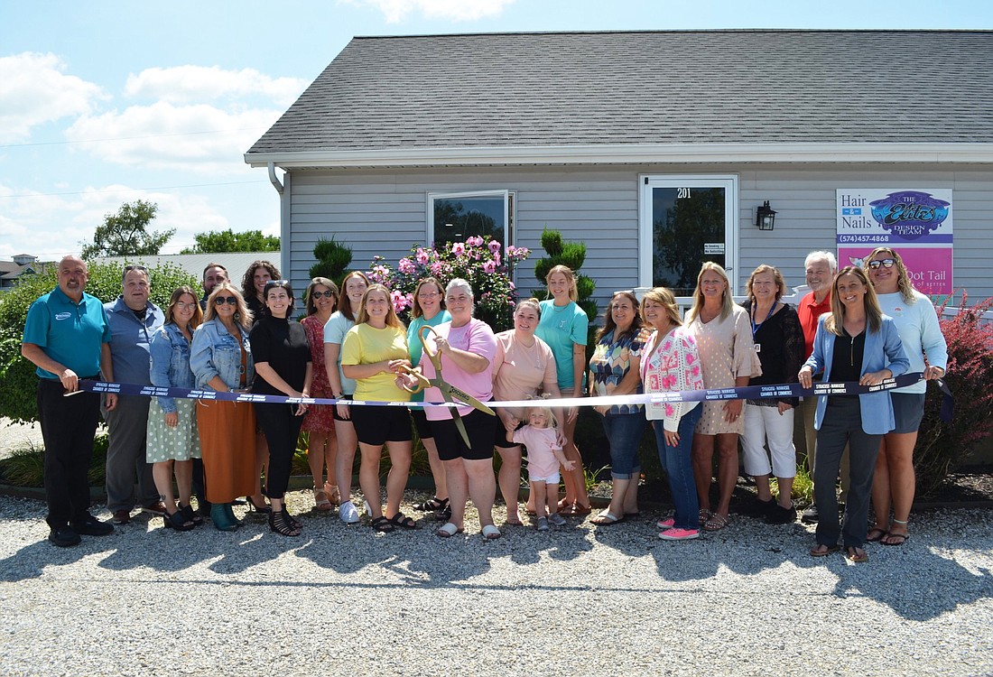 The Polka Dot Tail, 201 E. Bowser Road, Syracuse, held its ribbon cutting Monday. Pictured (L to R) are, front row: Melissa Paxton, The Waters of Syracuse, chamber ambassador; Stacey Leek, Stillwater Hospice, chamber ambassador; Kristi Hall, chamber ambassador; Maddison Knafel, The Polka Dot Tail; Marlene Shively, owner; Kinslee Knafel; and Mia Shively; and Ashley Dillon, director, Syracuse-Wawasee Chamber of Commerce; back row: Scott Wiley, Kosciusko Chamber; James Kofalt, Orange Rose Services, chamber ambassador; Jason Dewart, Interra Credit Union, chamber ambassador; Brittany Lyon, Titus Funeral Home, chamber ambassador; Jeanetta Slabaugh, Horizon Bank, chamber ambassador; Cydnie Lamb, The Polka Dot Tail; Tracey Altman, owner; Emily Rose, The Polka Dot Tail; Melissa Longenecker, ReMax, chamber ambassador; Angie Robbins, Ruoff Mortgage, chamber ambassador; Marlies West, Goshen Home Medical, chamber ambassador; Dan Buchman, State Farm, chamber ambassador; and Jessica Barger, Lakeland Youth Center, chamber board member. Photo by Phoebe Muthart, InkFreeNews