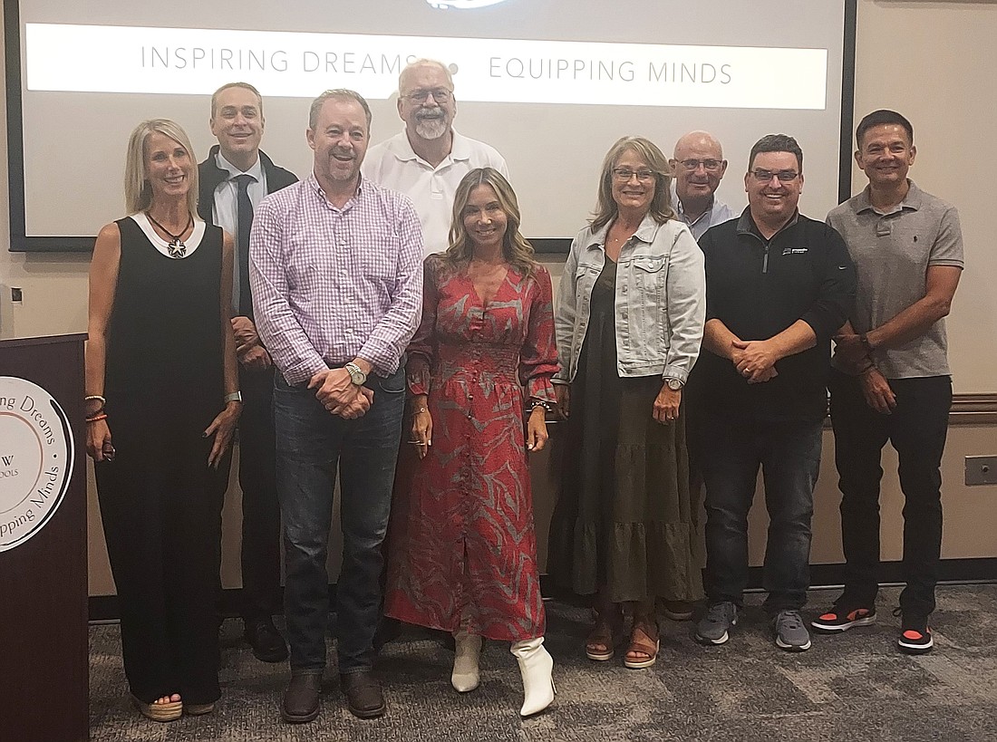 Pictured are Atelier Director Sea Grandon with husband Jon, Warsaw Community School Corporation Superintendent Dr. David Hoffert and the Warsaw School Board members. Photo by Jackie Gorski, Times-Union