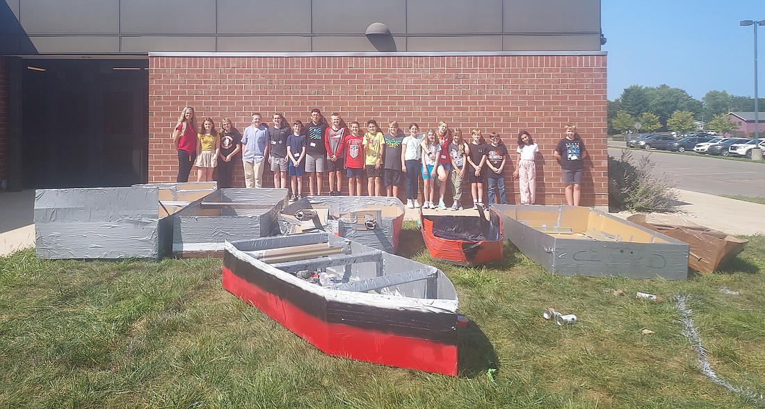 Pictured are Project Lead the Way teacher Abbi Richcreek and the 23 seventh- and eighth-grade Edgewood Middle School students who are building cardboard boats for Saturday’s Canal Days. Photo by Jackie Gorski, Times-Union