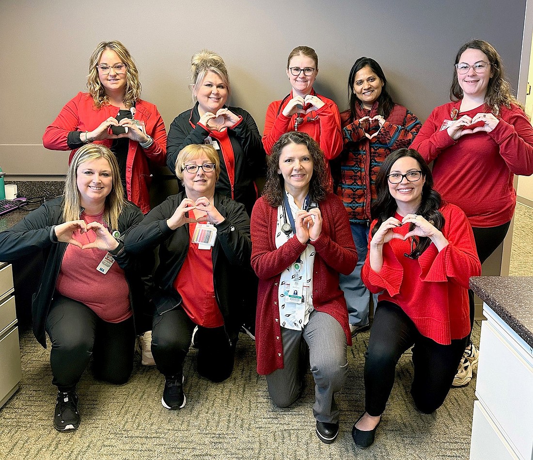 Parkview employees flash hand hearts while posing during National Wear Red Day on Feb. 2 during American Heart Month. Workers throughout changed their signature Parkview green to red for the day to raise awareness of cardiovascular disease.